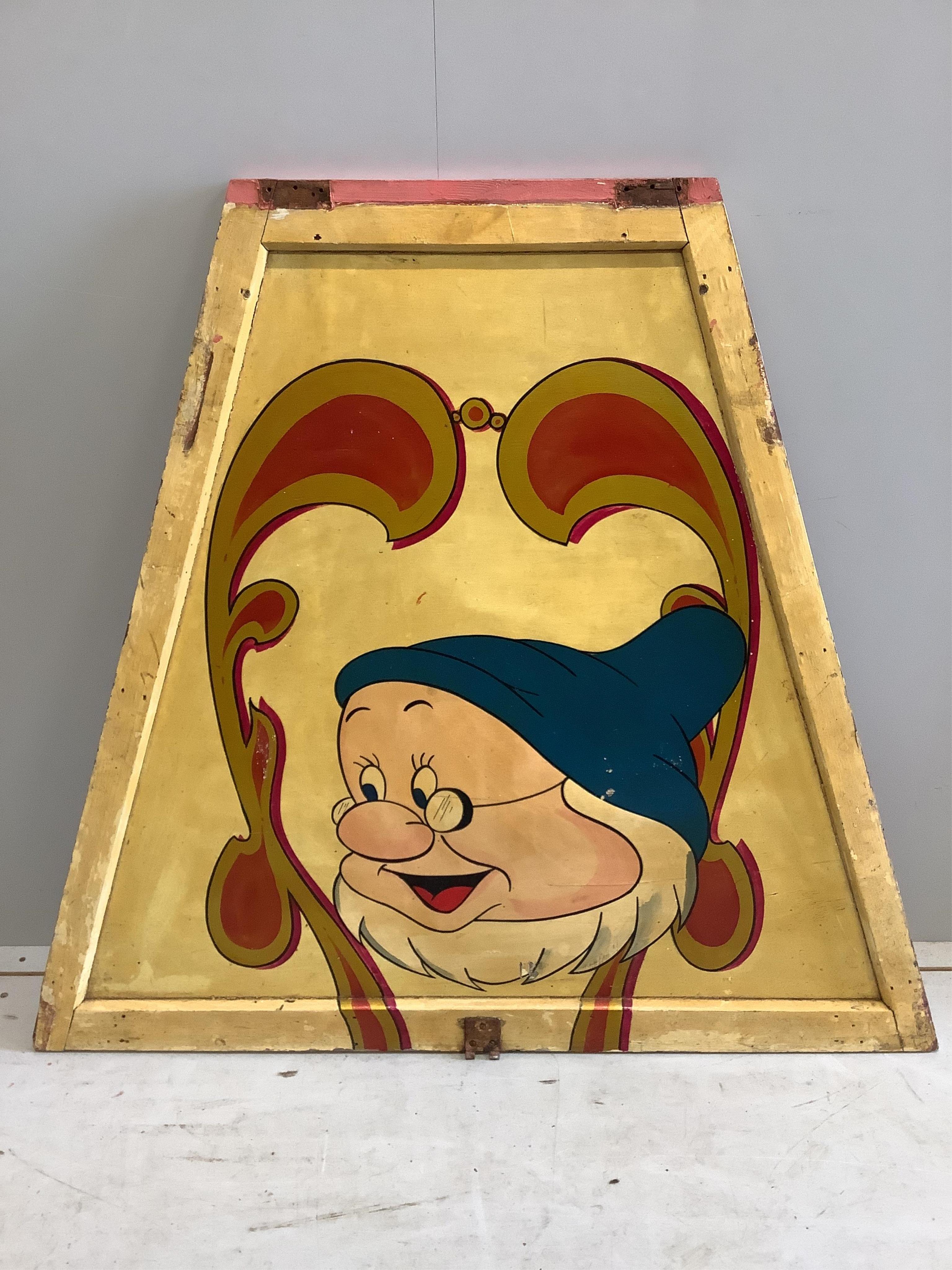 A mid century “Doc” painted wood fairground carousel panel of tapered rectangular form, width 104cm, height 94cm. Condition - fair